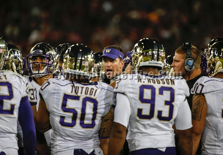2013Stanford-Wash-068.JPG - Oct. 5, 2013; Stanford, CA, USA; Washington Huskies defensive coordinator Justin Wilcox (center) addresses the team during a time out at game against the Stanford Cardinal at  Stanford Stadium. Stanford defeated Washington 31-28.